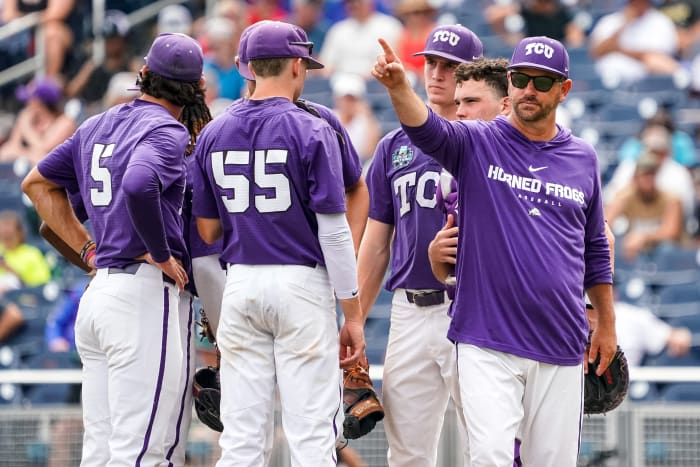 Jun 21, 2023; Omaha, NE, USA; TCU Horned Frogs head coach Kirk Saarloos points to the bullpen during the ninth inning against the Florida Gators at Charles Schwab Field Omaha. Mandatory Credit: Dylan Widger-USA TODAY Sports